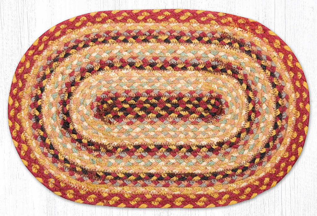 burgundy, mustard yellow black, soft sage green oval placemat made from braided jute. 