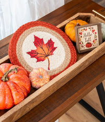 Trivet with maple leaf design made from organic braided jute. 