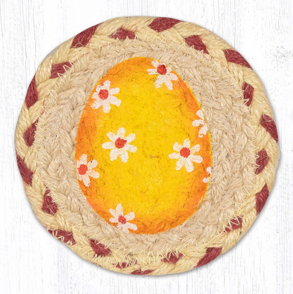 Coaster with yellow Easter egg design with white daisies. 