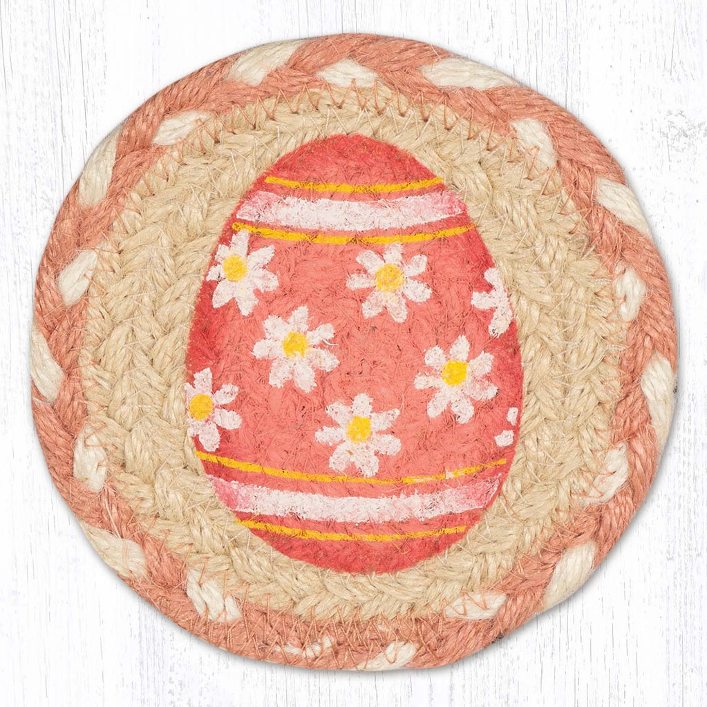 Coaster with pink Easter egg design with white daisy flowers. 