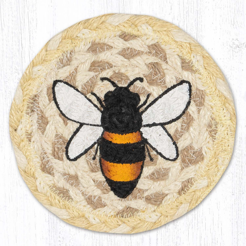 Coaster with bee design. Soft yellow and tan jute with black, yellow and white bee.