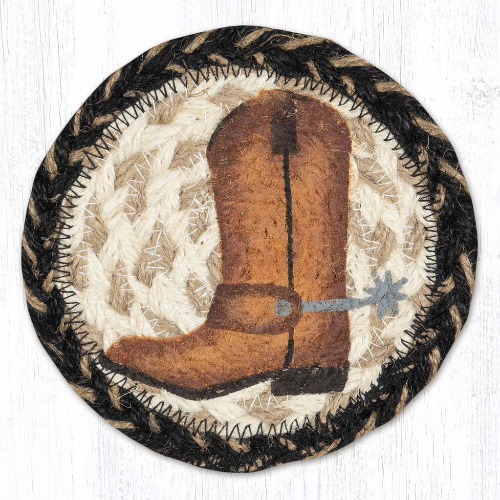 Coaster with cowboy boot design in light tan, black and brown. 