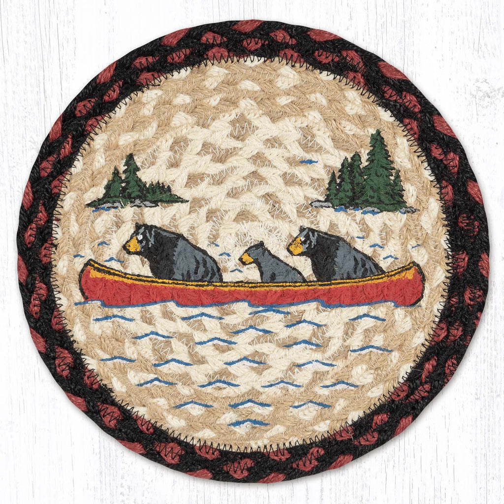 trivet with black bears in red canoe on a lake