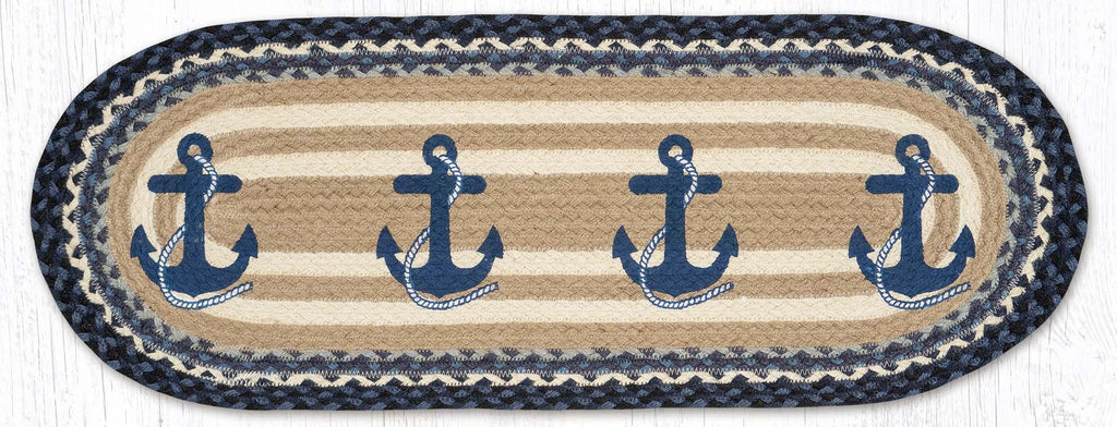 Oval table runner with blue navy anchor design on blue, tan, and white braided jute. 